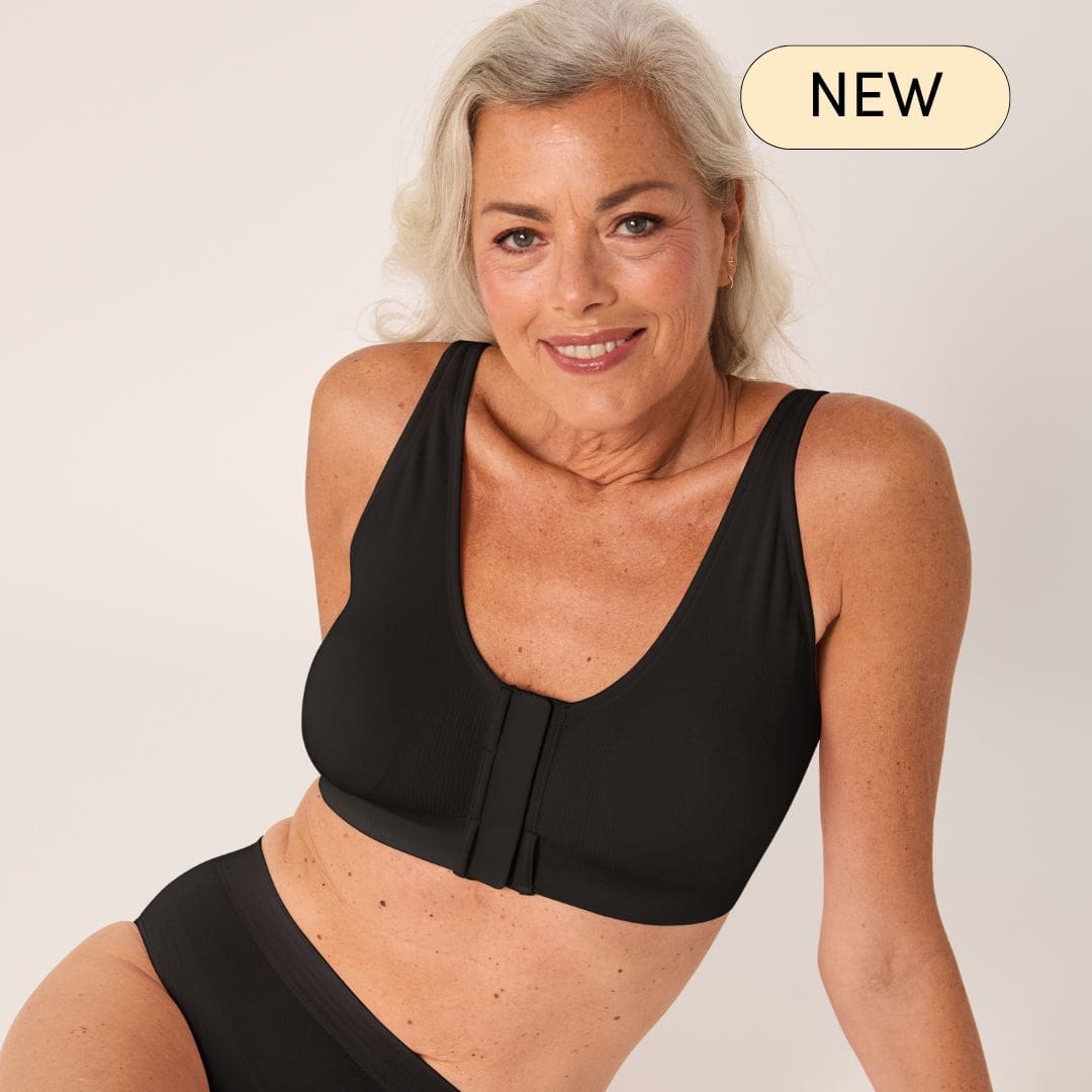 older woman wearing black front closure bra