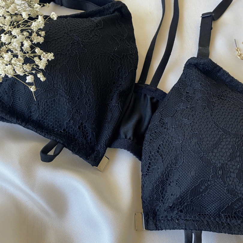 Flat lay image of the Liberare black convertible bralette