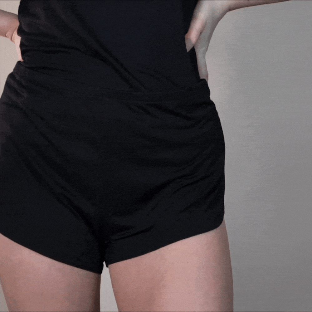 Video of a woman spinning in black slumber shorts